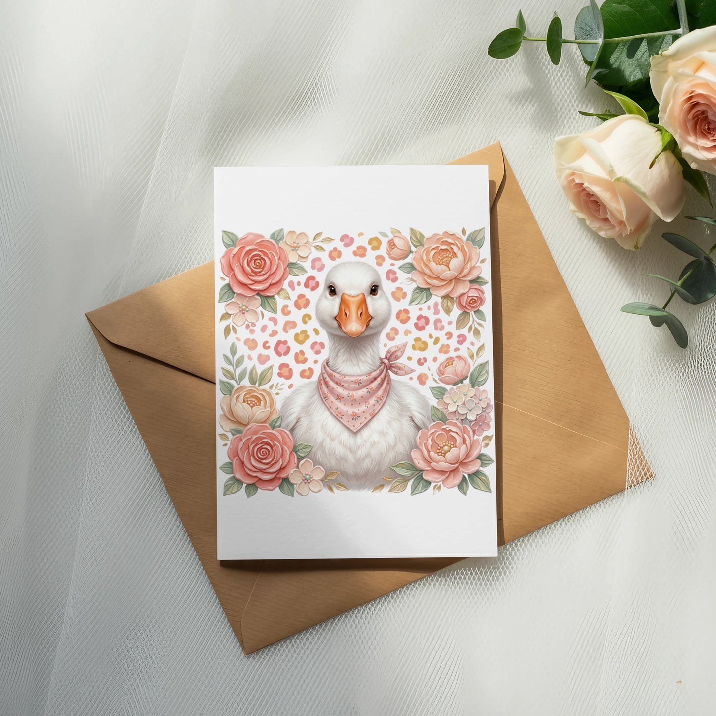 White goose wearing a pink bandana, surrounded by flowers, on a card.