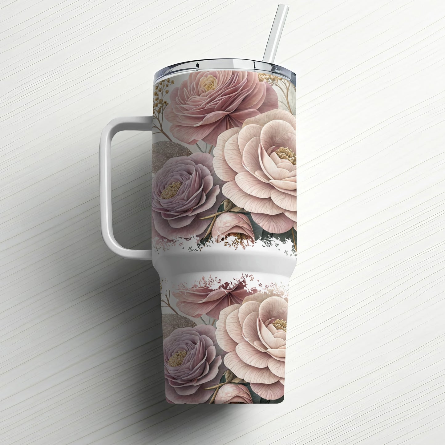 Tumbler with a floral pattern of pink and mauve roses, straw in lid.