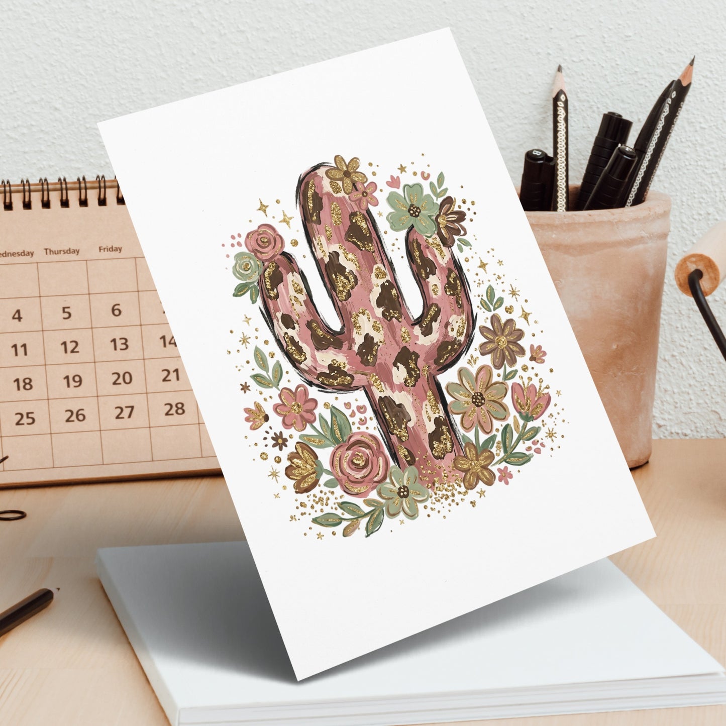 Illustration of a stylized cactus with floral accents on white cardstock.