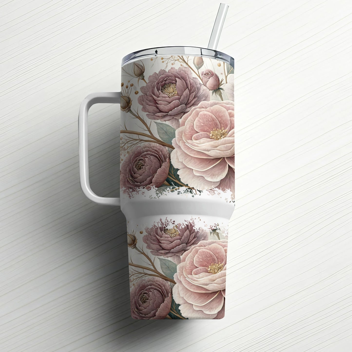 White tumbler with a muted floral pattern and a straw.