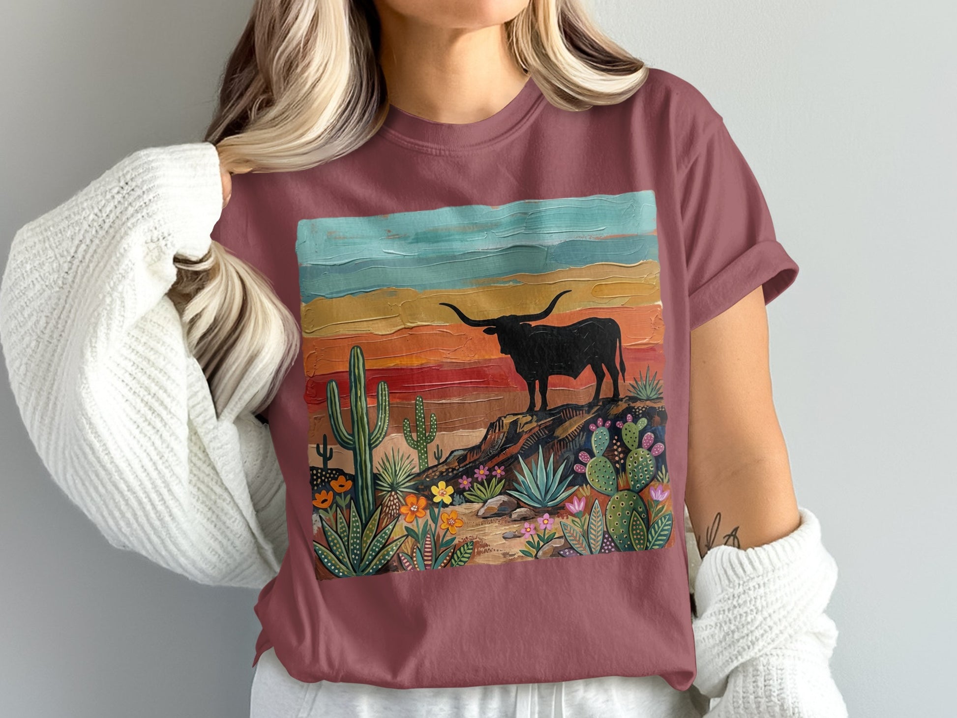 T-shirt with painted desert scene featuring a longhorn bull and cacti.