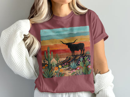 T-shirt with painted desert scene featuring a longhorn bull and cacti.