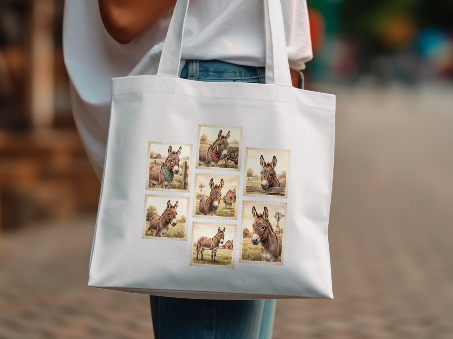 White tote bag with a collage of donkey postage stamps.