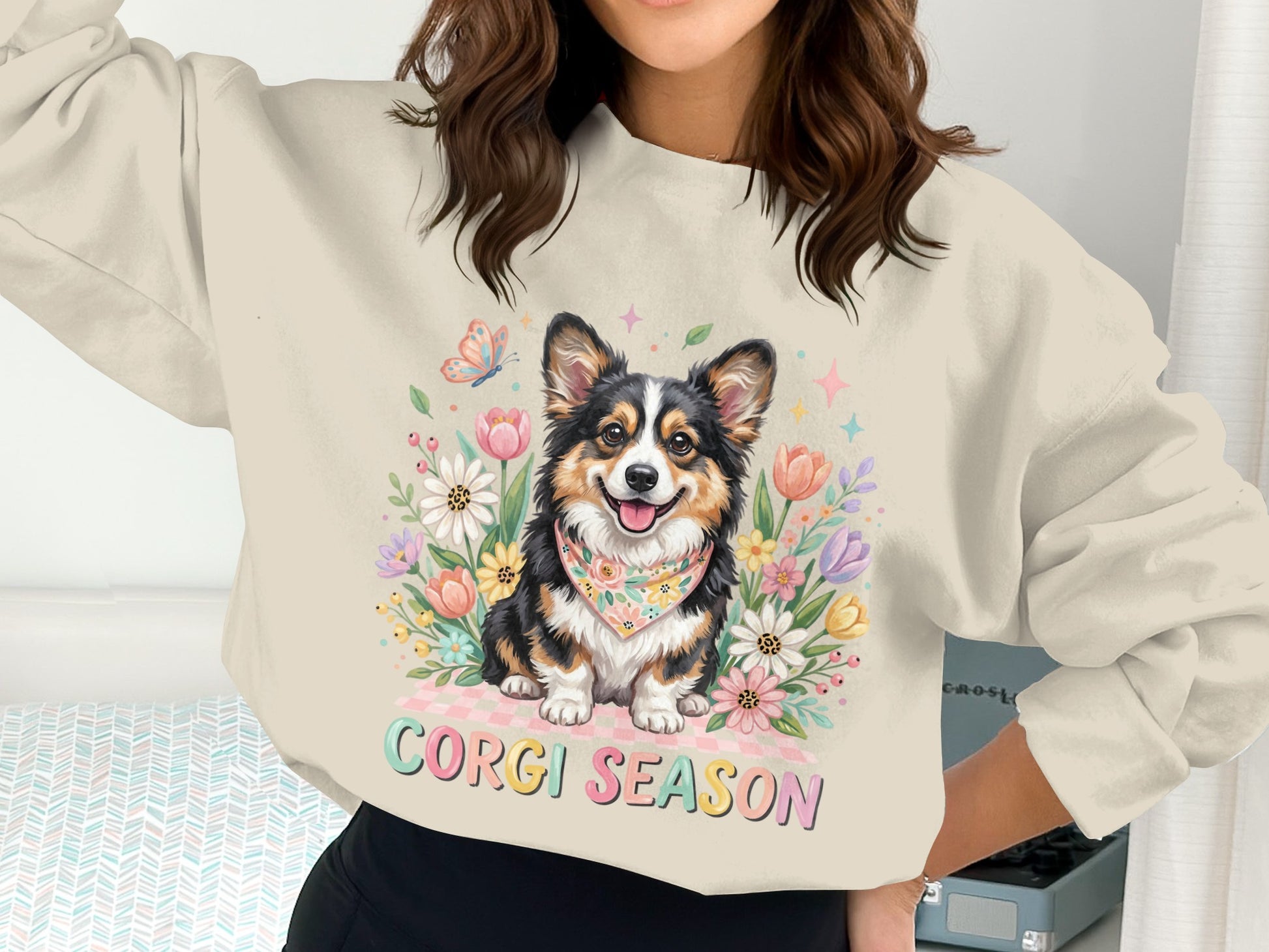 Corgi wearing a bandana surrounded by flowers, with text "Corgi Season".