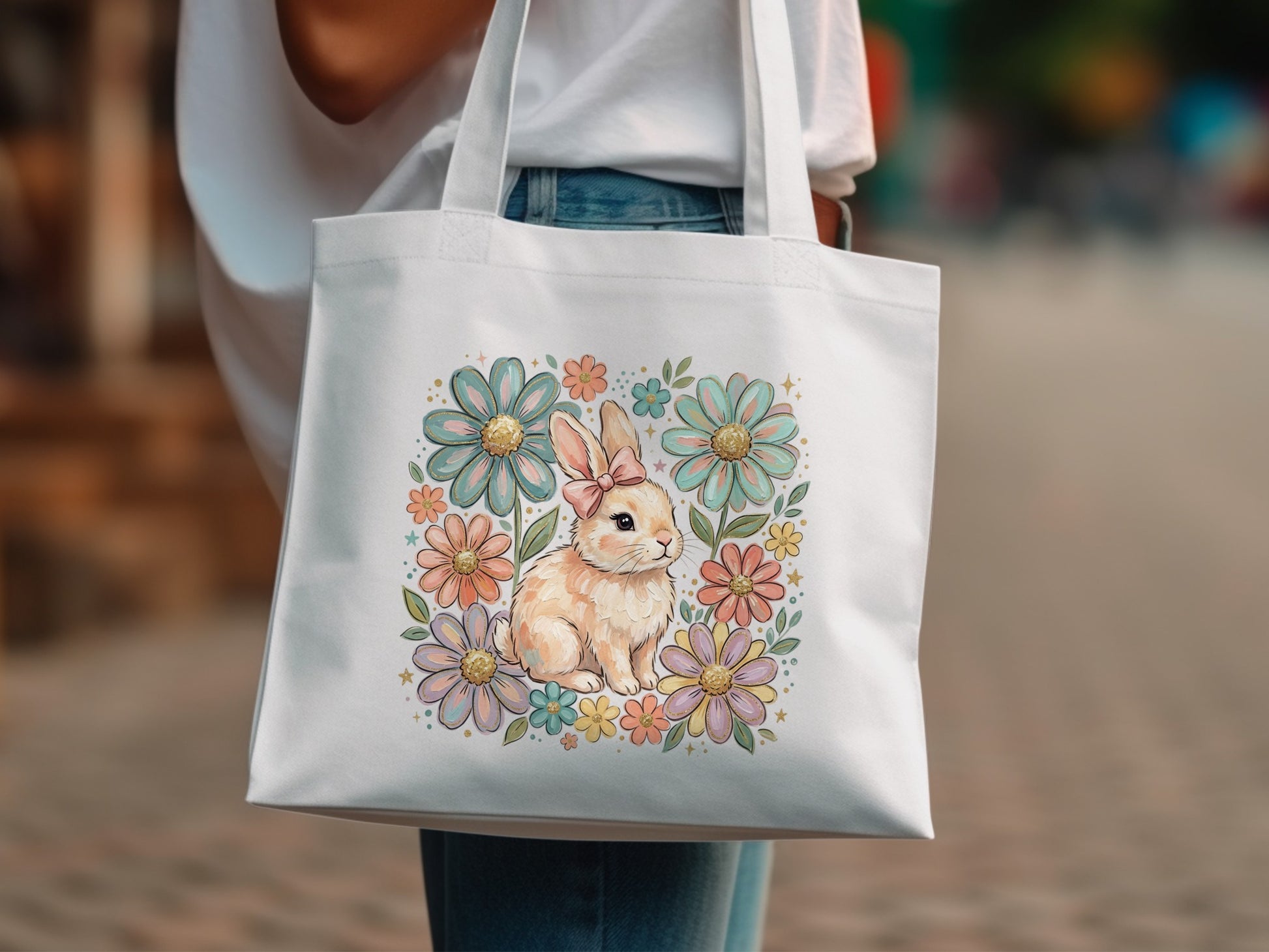 White tote bag with a pastel bunny and floral illustration.