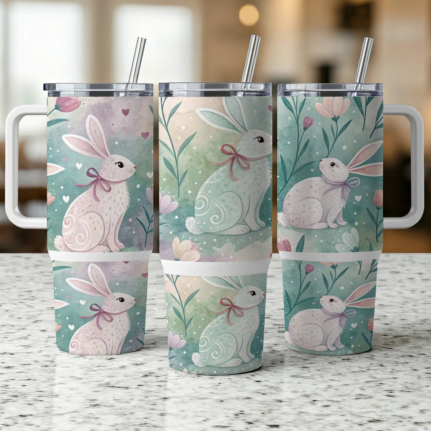 Three tumblers with bunnies and flowers, two in front, one behind.