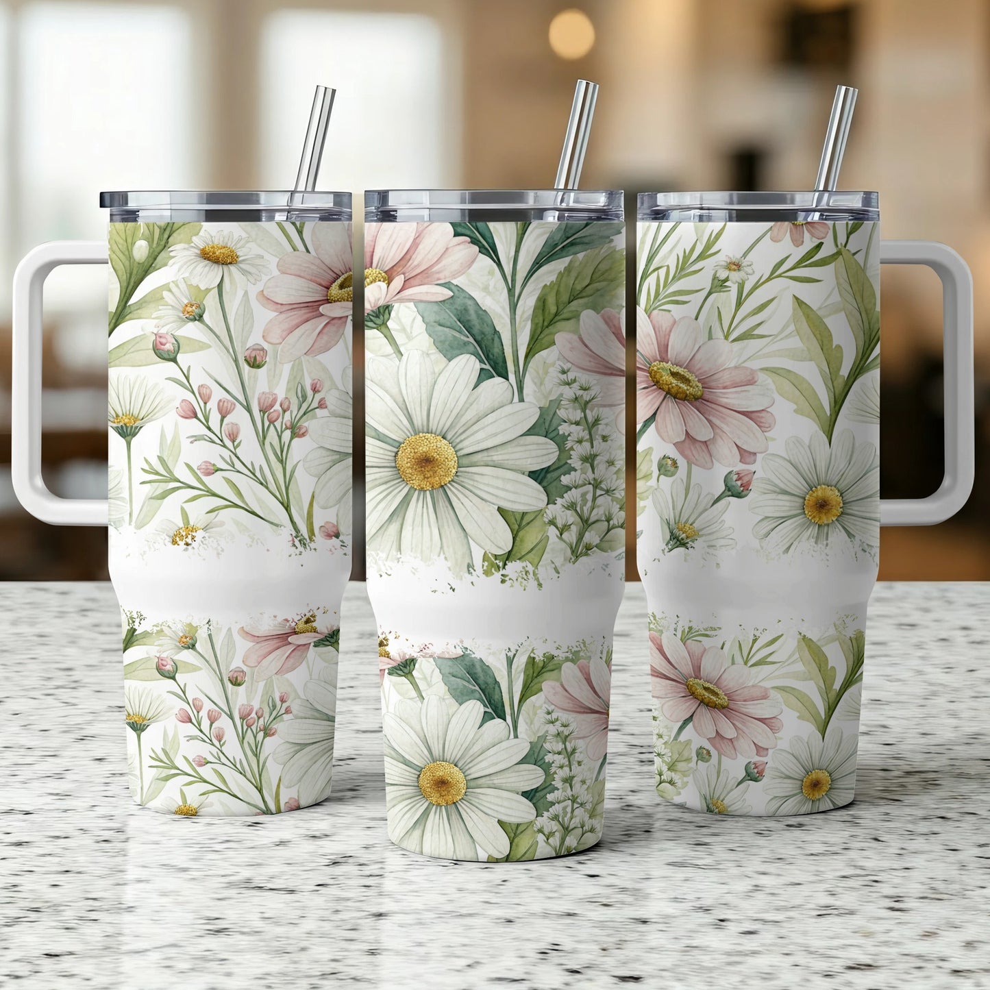 Three insulated tumblers with a floral daisy and greenery watercolor design.
