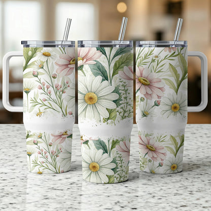 Three insulated tumblers with a floral daisy and greenery watercolor design.