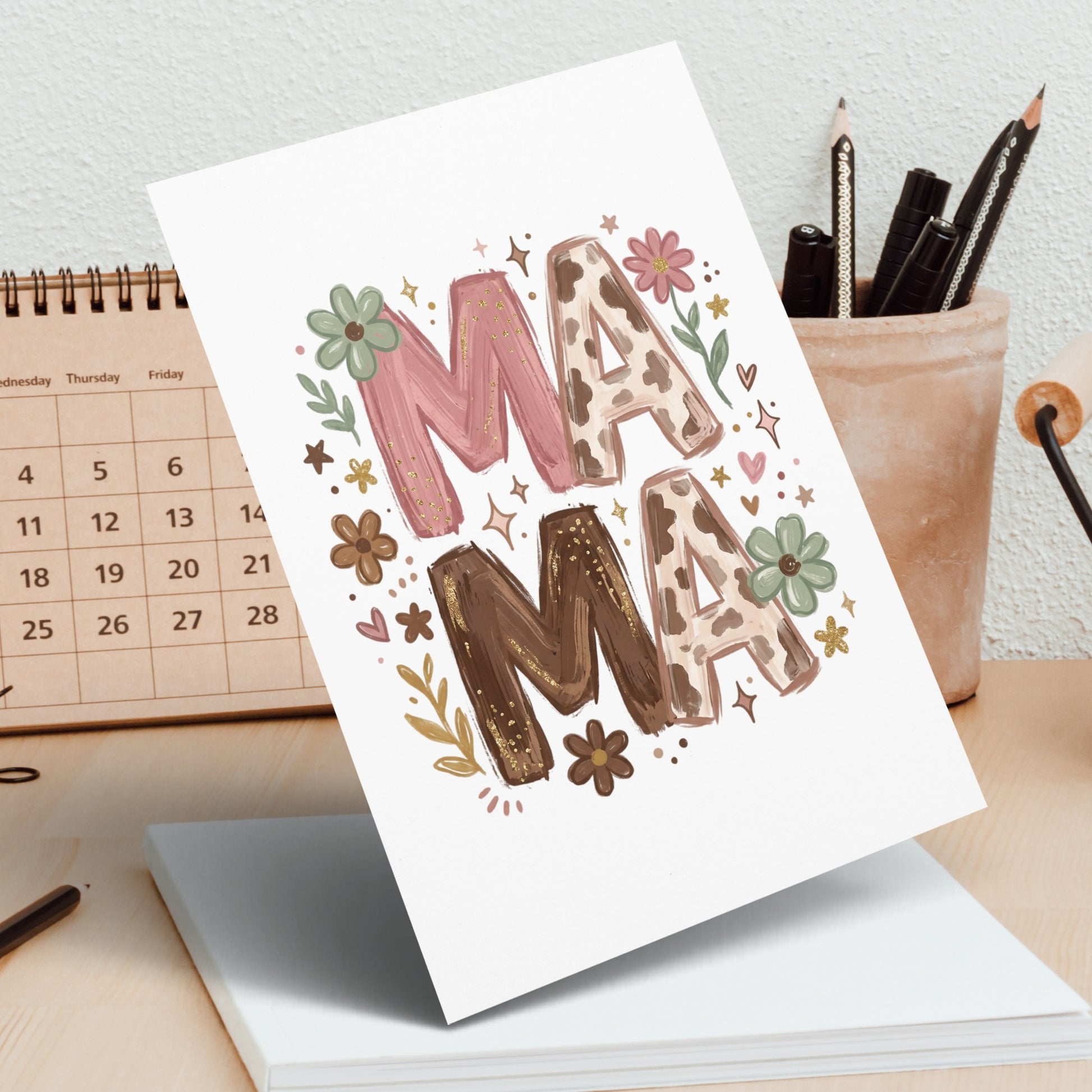 Mama graphic with flowers and cow print accents on white card.