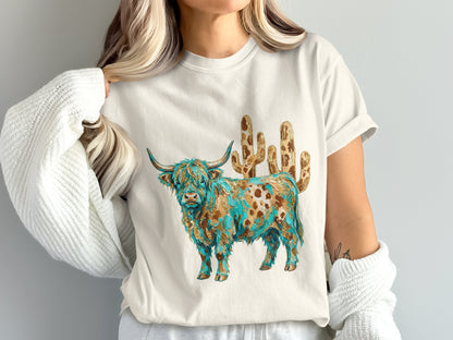 Cream t-shirt with a Highland cow and cactus design.