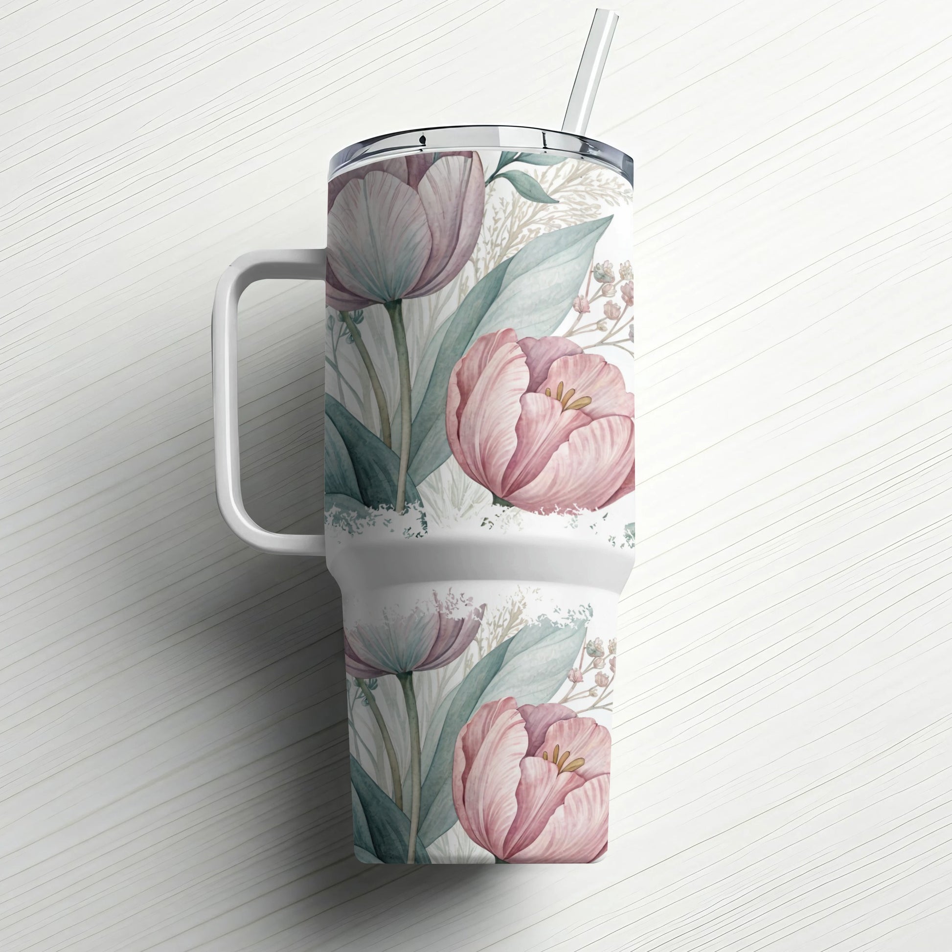 Pink tulips and green leaves watercolor design on white tumbler with handle and straw.