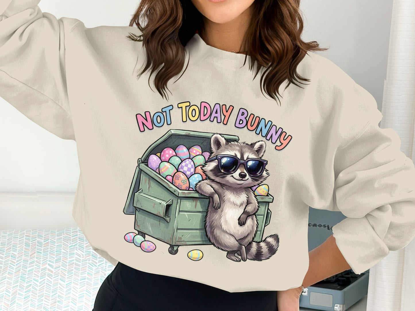 Crewneck sweatshirt with raccoon and Easter eggs, "Not Today Bunny" text.