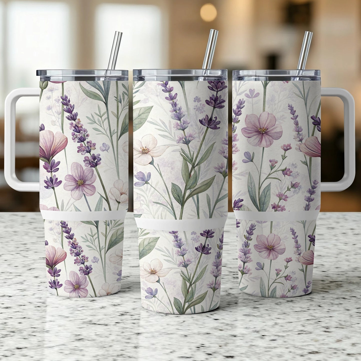 Three tumblers with a floral and lavender pattern, each with a straw.