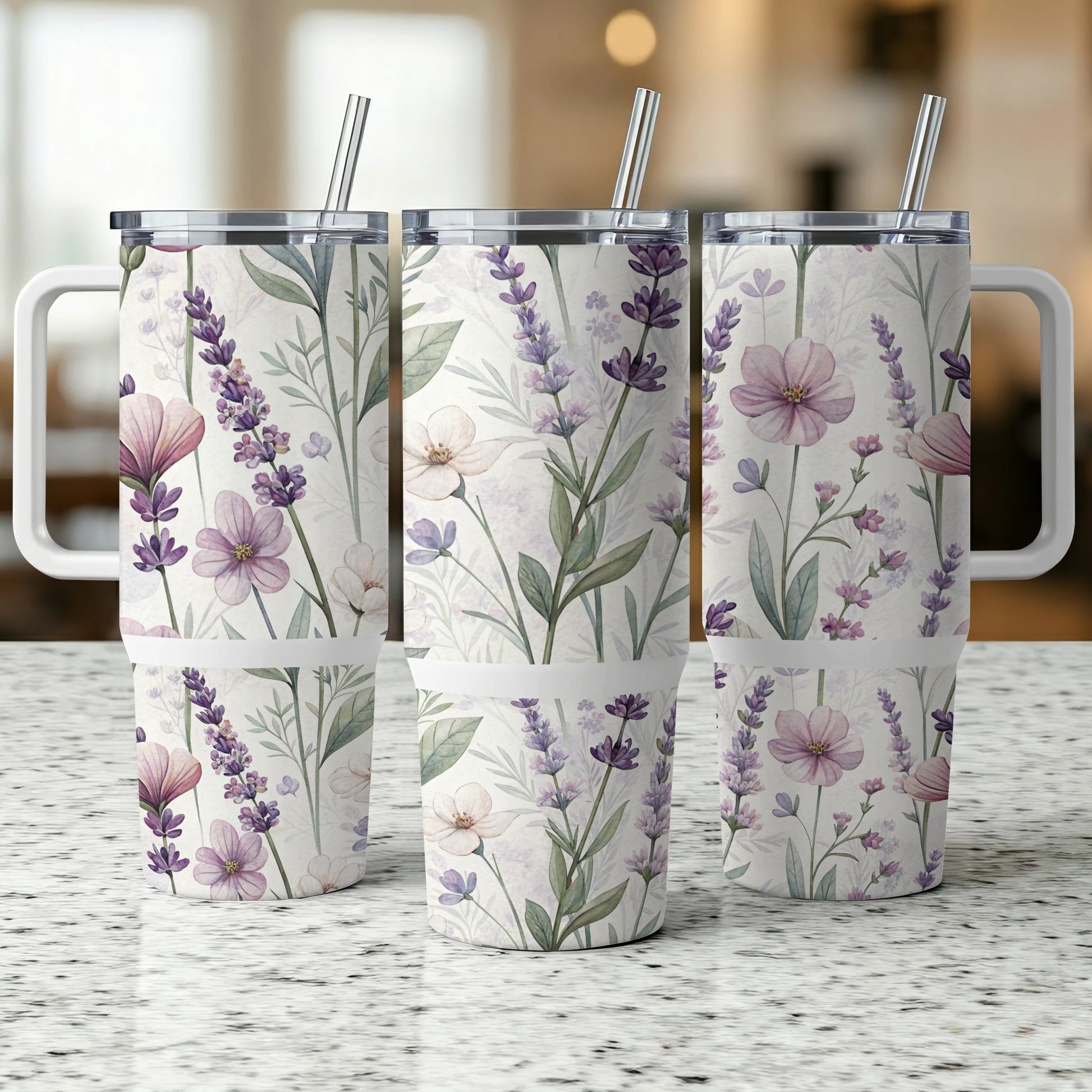 Three tumblers with a floral and lavender pattern, each with a straw.