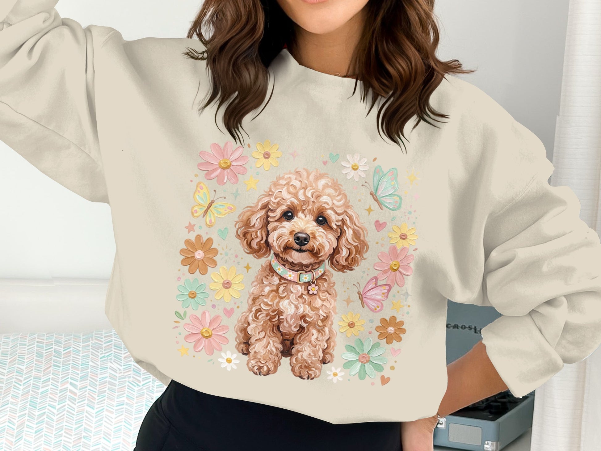 Fawn poodle wearing a colorful collar surrounded by pastel flowers and butterflies.