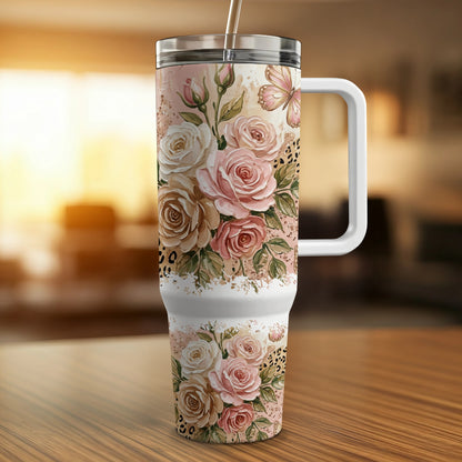 Tumbler with pink and white roses and a butterfly.