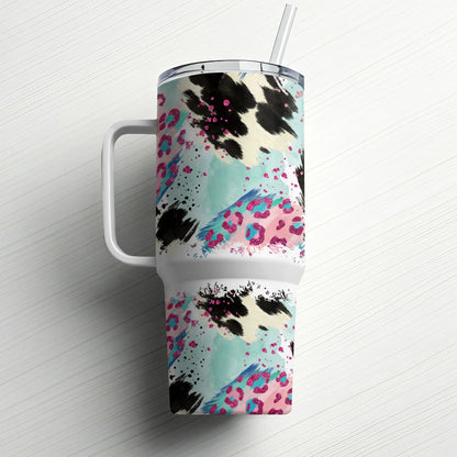 White tumbler with cow print and pink leopard pattern, straw included.
