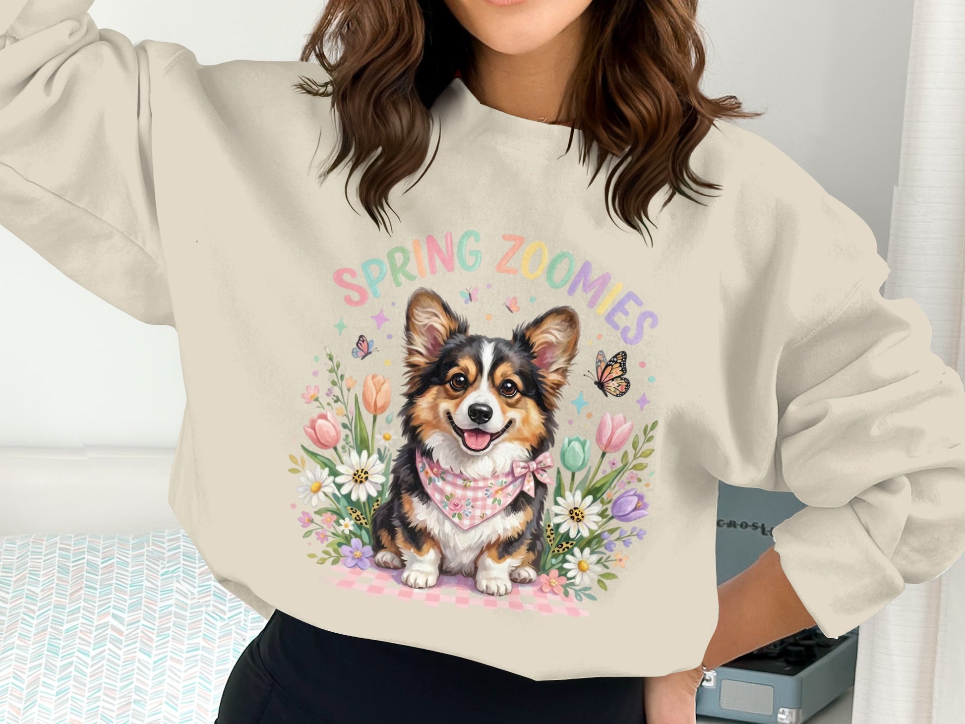 Spring Zoomies sweatshirt featuring a Corgi dog among flowers and butterflies.