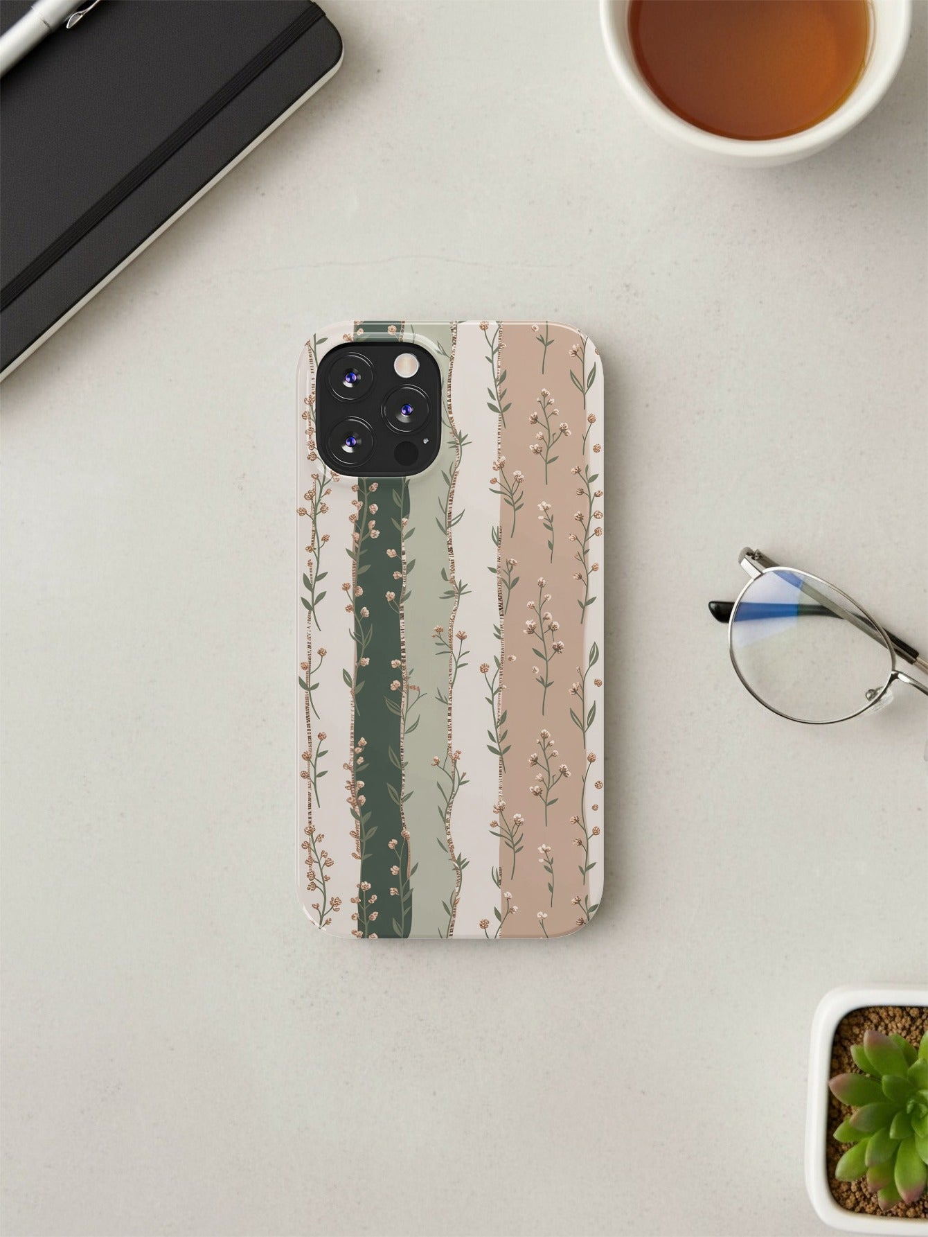 iPhone 14 Pro case with vertical floral stripe pattern.