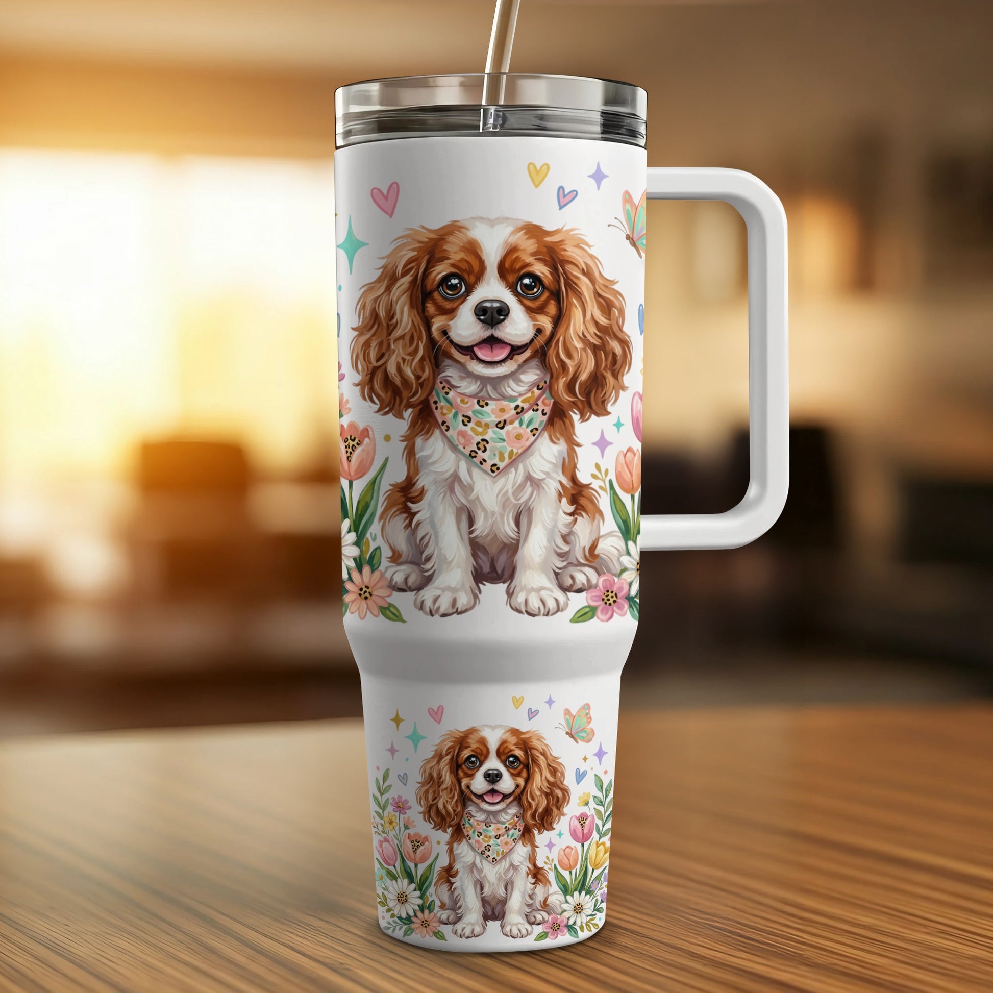 White travel mug with Cavalier King Charles Spaniel and floral pattern.