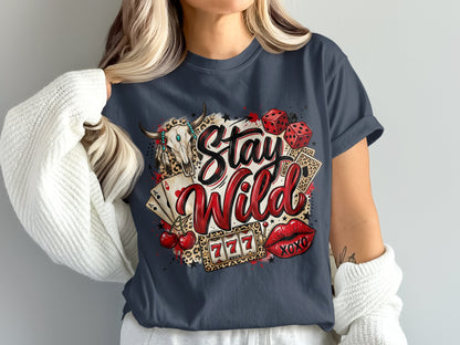 T-shirt design with "Stay Wild" text, skull, dice, cards, cherries, and lips.