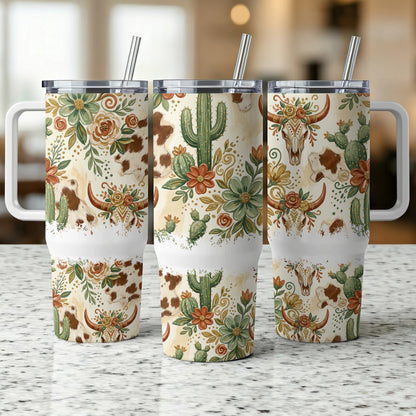 Tumbler with cowhide, cacti, and floral southwestern pattern.