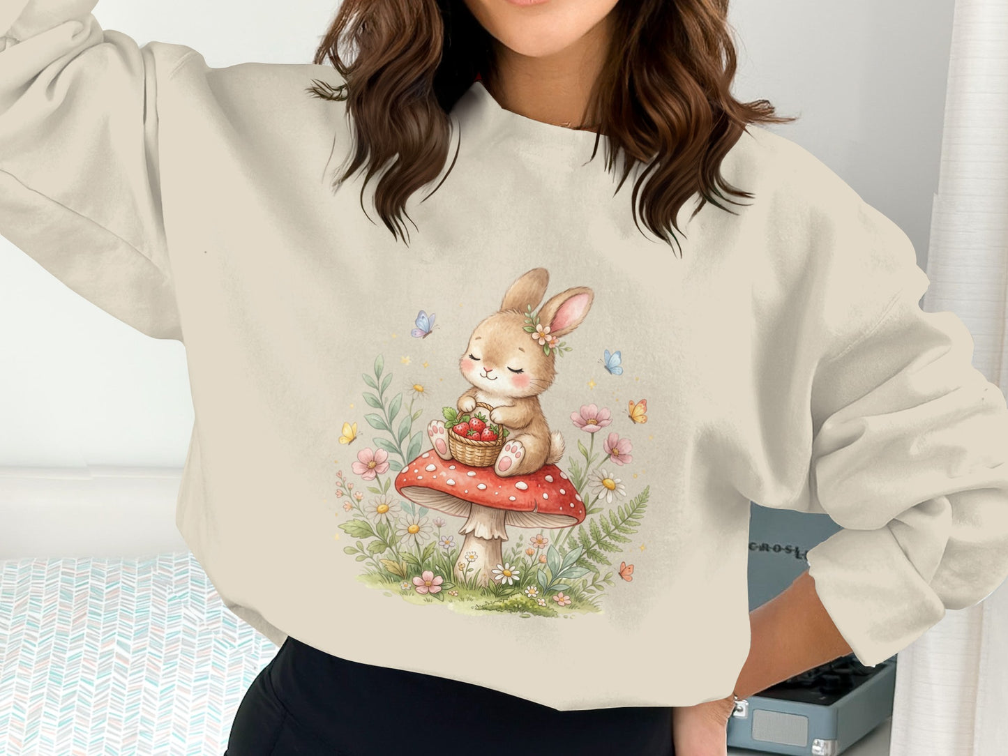 Illustration of a bunny in a basket of strawberries sitting on a mushroom.