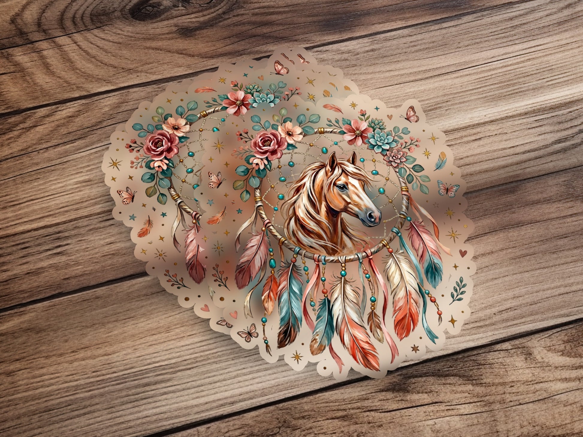 Dreamcatcher with horse, flowers, and feathers on wooden background.
