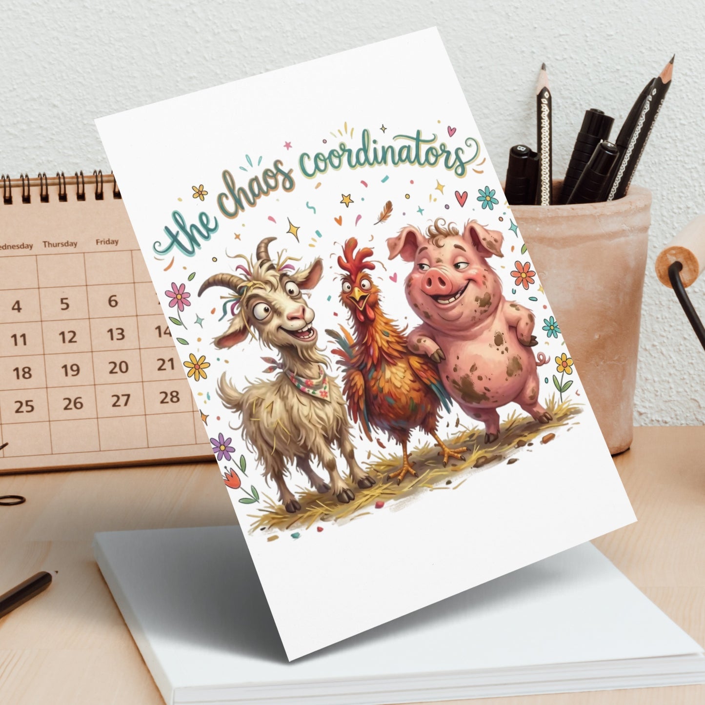 Greeting card with "the chaos coordinators" text and cartoon goat, chicken, and pig.