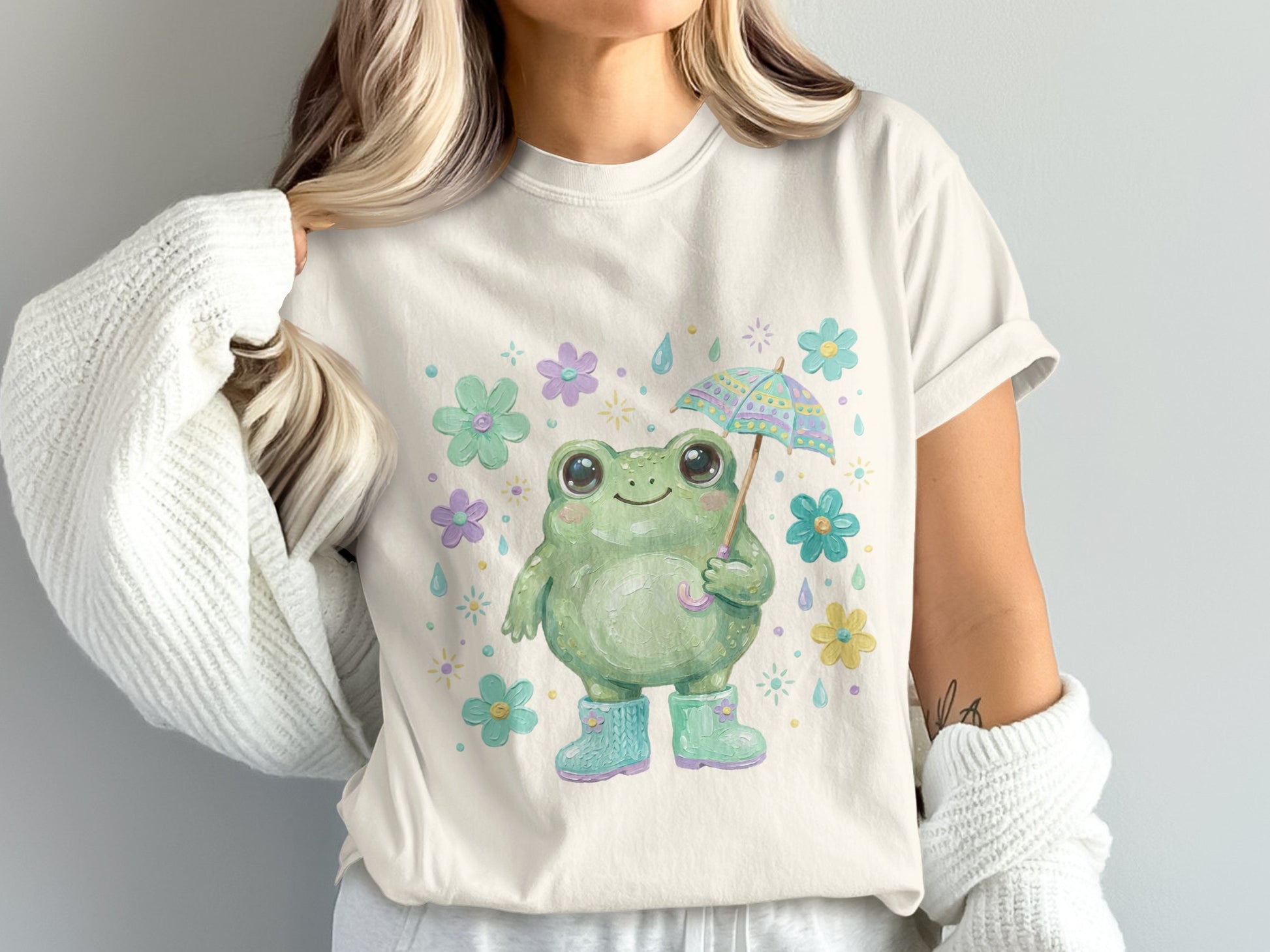 Cute frog with umbrella and boots, surrounded by flowers.