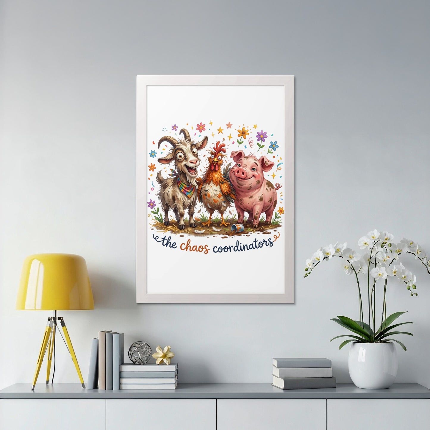 Framed cartoon featuring a goat, chicken, and pig with "the chaos coordinators" text.