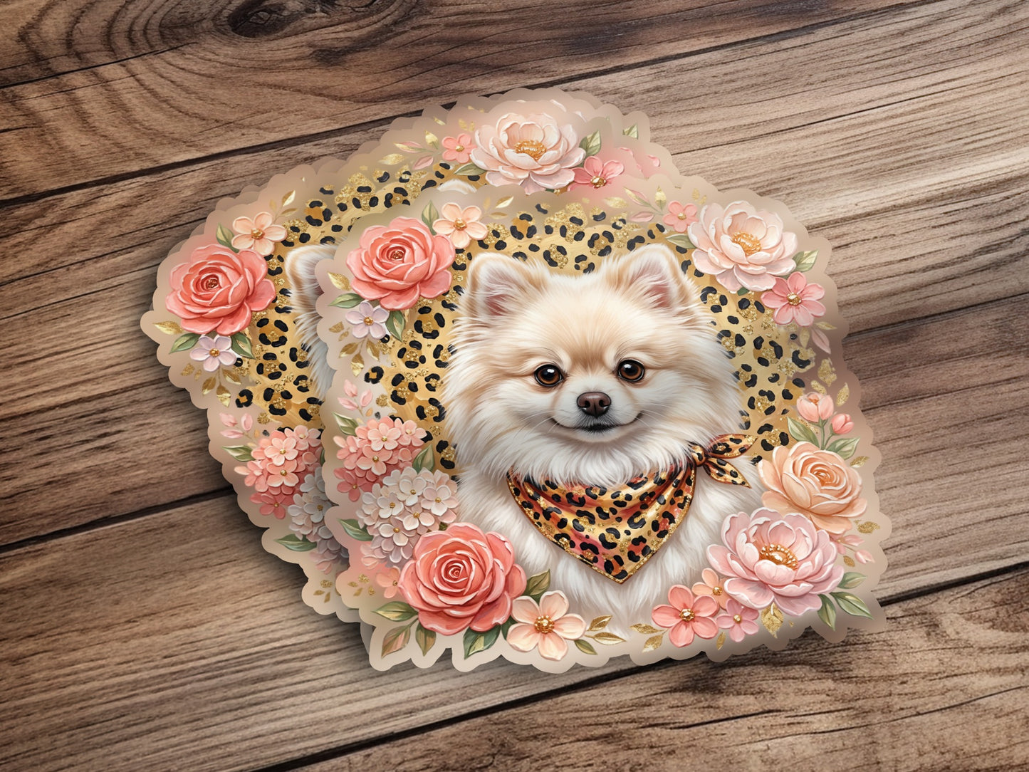 Pomeranian dog wearing a leopard print bandana surrounded by flowers.