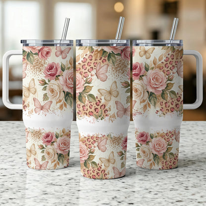 Three tumblers with floral and butterfly design on leopard print background.