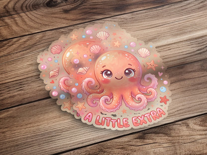 Kawaii octopus sticker with "A LITTLE EXTRA" text and seashells.