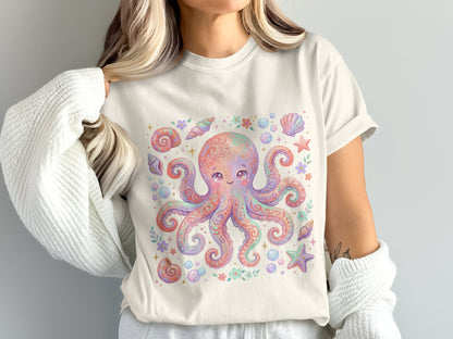 Cream t-shirt with pastel octopus, seashells, and starfish graphic.