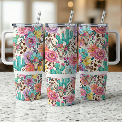 Three tumblers with floral and bull skull pattern, featuring cacti and cowhide.