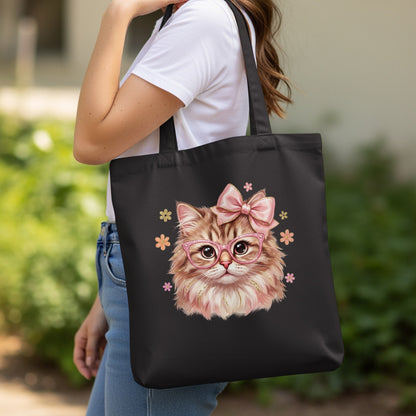 Black tote bag with a fluffy cat wearing pink glasses and a bow.