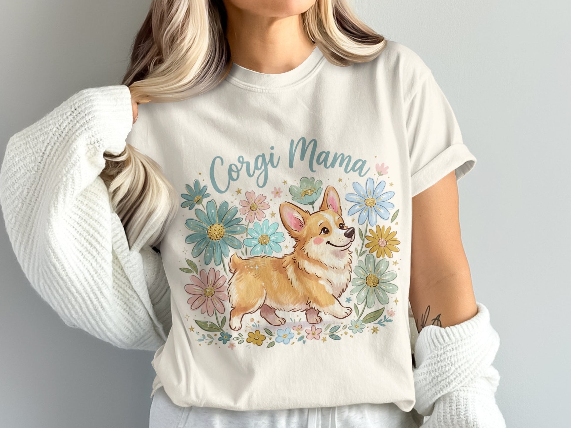 Cream t-shirt with "Corgi Mama" text and a smiling corgi surrounded by flowers.