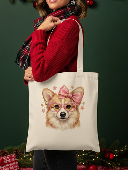 Corgi wearing pink glasses and a bow on a canvas tote bag.