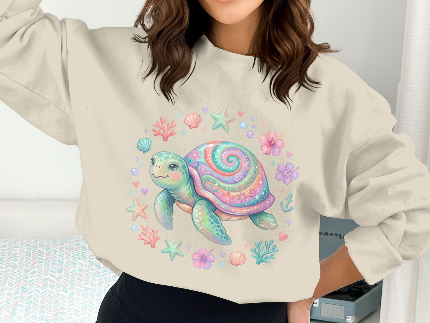 Sweatshirt with colorful cartoon sea turtle and ocean motifs.