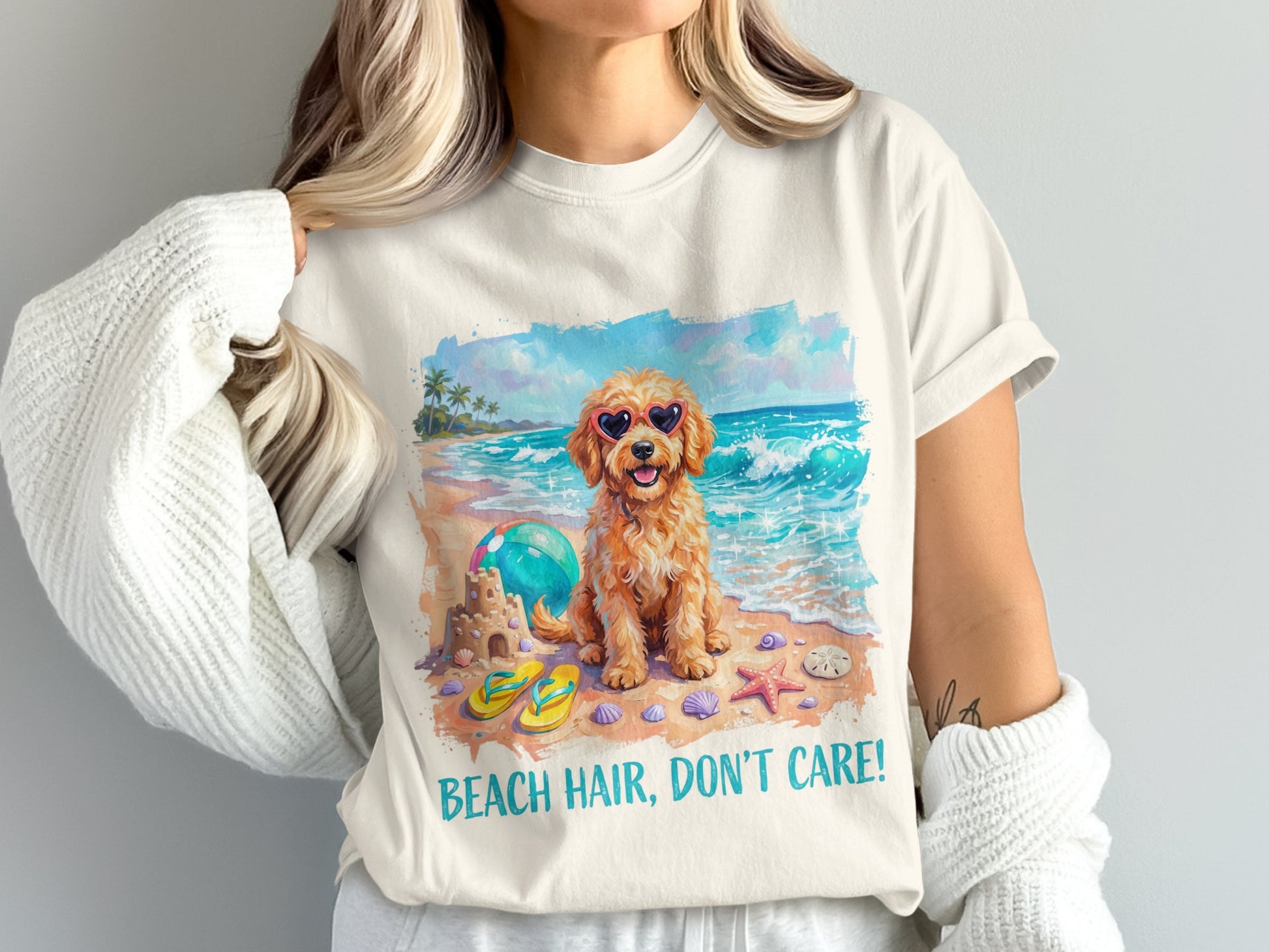 Golden doodle wearing heart sunglasses on a beach with text.
