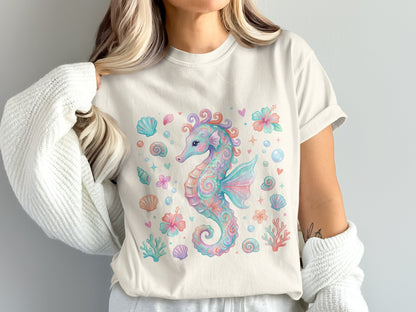 Watercolor seahorse with shells and flowers, on a cream t-shirt.