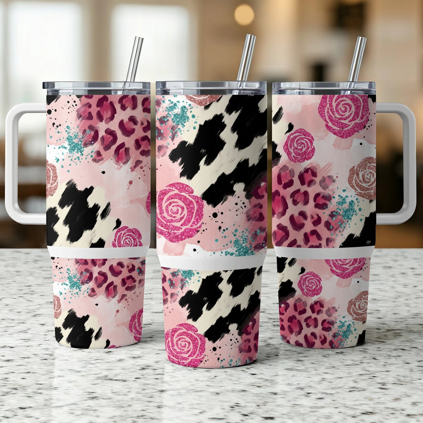 Three tumblers with pink roses, leopard print, and cow print designs.