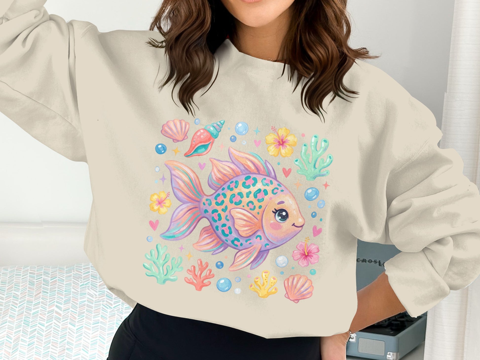 Crewneck sweatshirt with colorful cartoon goldfish and aquatic sea life print.