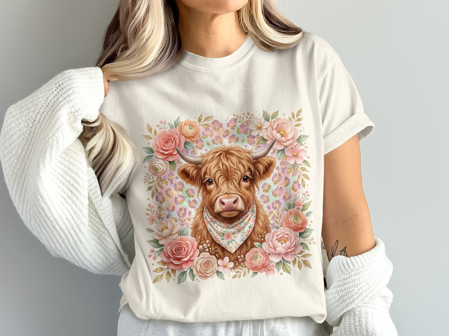 Cream t-shirt with Highland cow wearing bandana, surrounded by floral wreath.