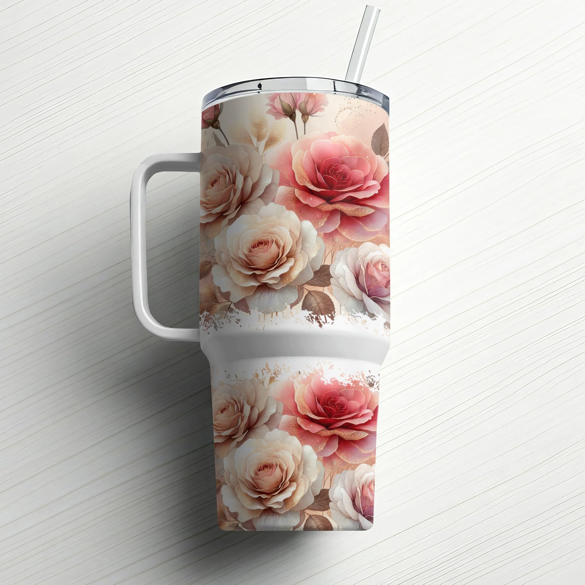 Pink and cream roses adorn a large white tumbler with a straw and handle.