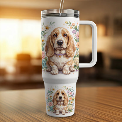Basset Hound dog illustration with floral accents on a travel tumbler.