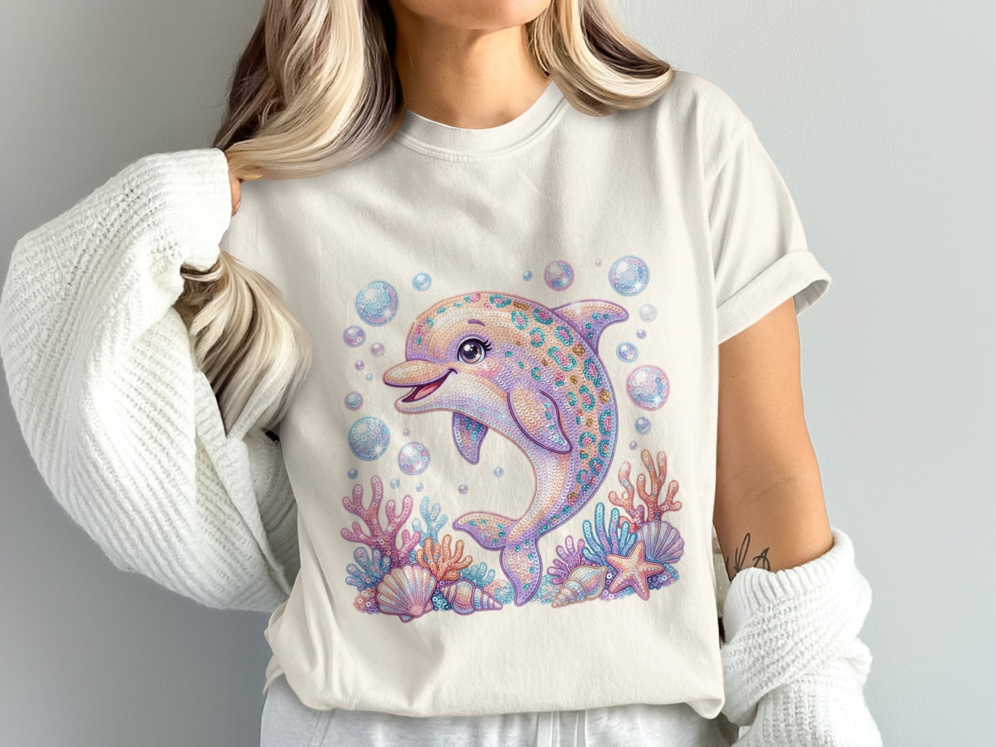 Sparkling dolphin with shells and coral, surrounded by bubbles.