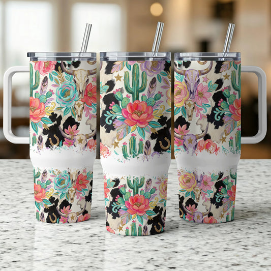 Three tumblers with cow skull, cactus, and floral desert art.