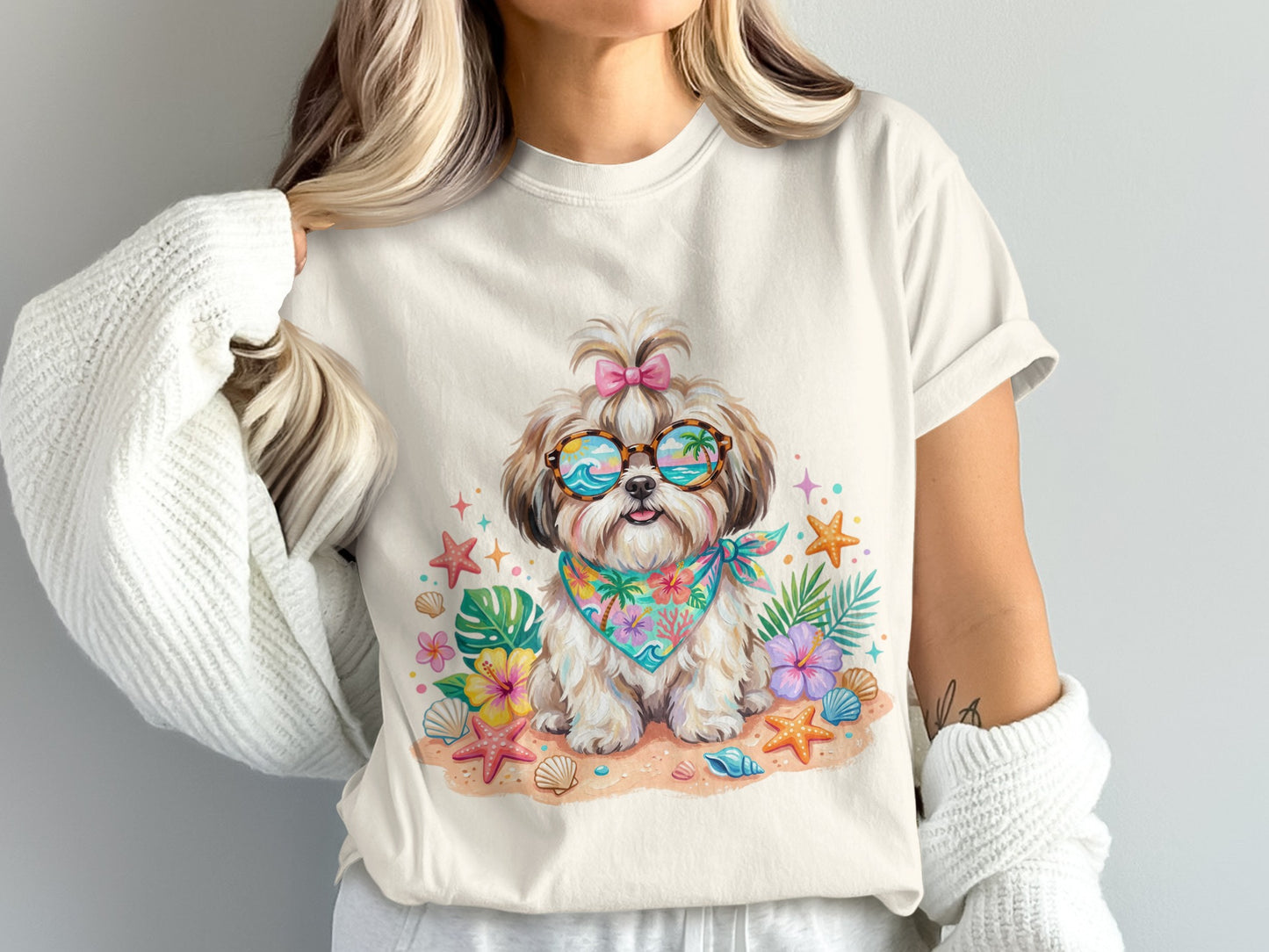 Woman wearing a white t-shirt with a beach-themed cartoon dog graphic.